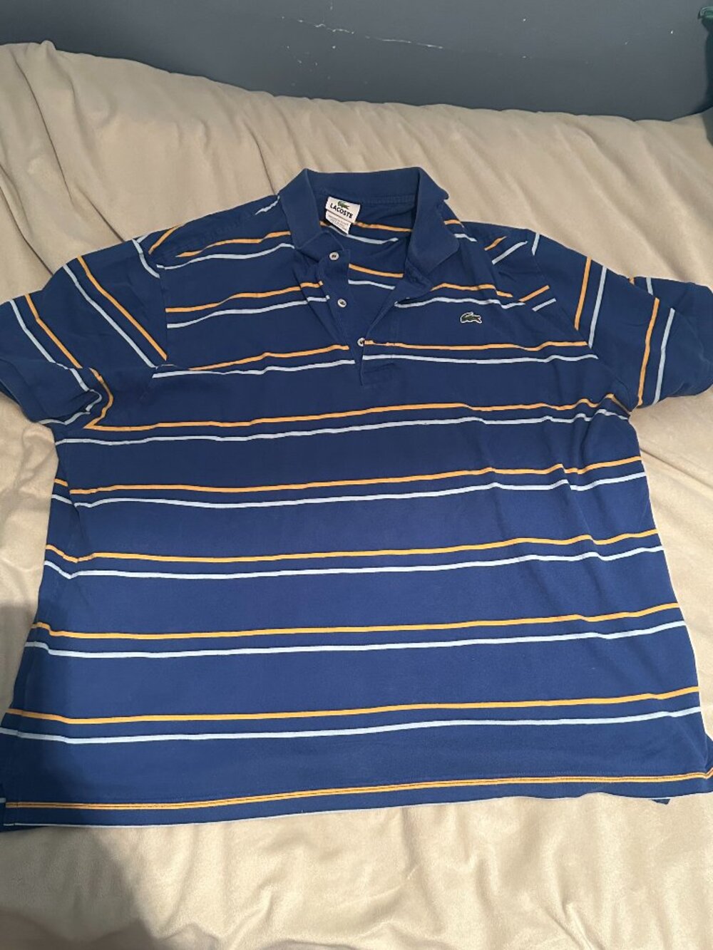 Blue Lacoste polo w/ yellow and white stripes